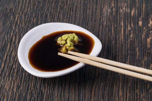 Bowl with soy sauce and wasabi